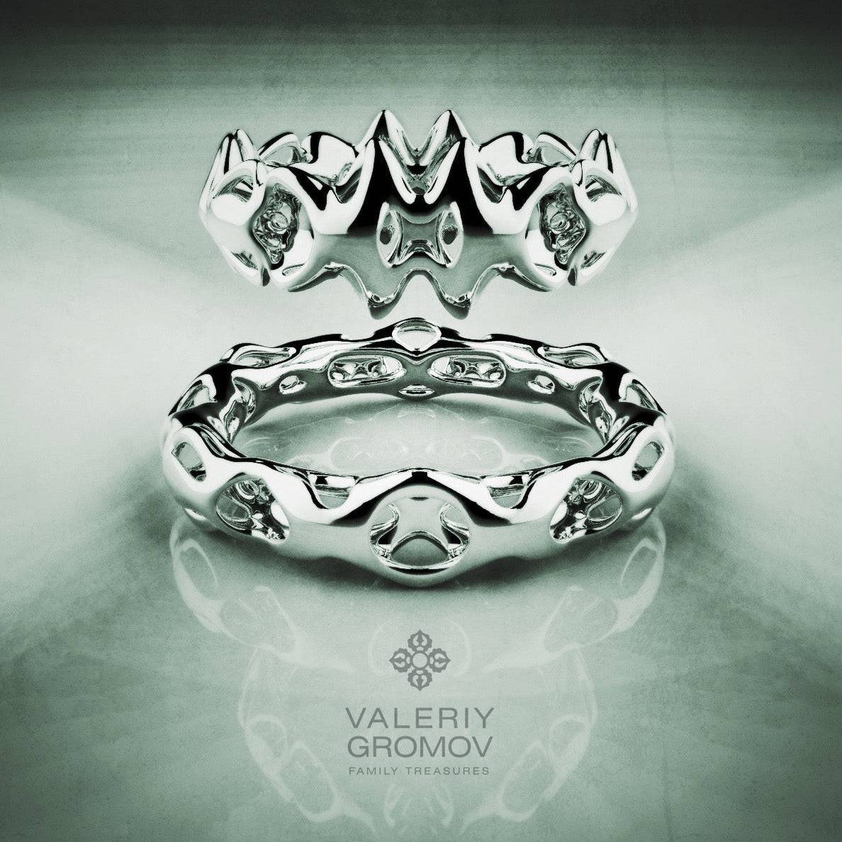 White Gold ring with intricate design on a reflective surface, featuring the Valeriy Gromov brand
