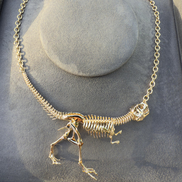 Yellow Solid Gold 18k Tyrannosaur NEX necklace—an articulated T-rex skeleton