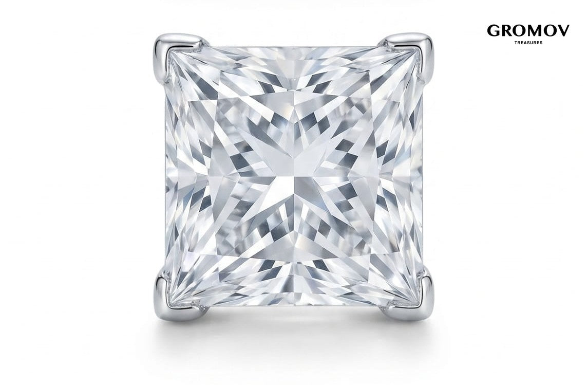 Macro view of a natural princess cut diamond stud earring in 18K white gold four-prong V-tip setting