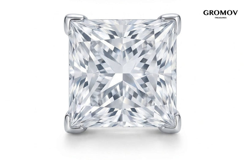 Macro view of a natural princess cut diamond stud earring in 18K white gold four-prong V-tip setting