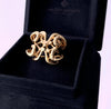 Gold Bone Armor Ring by Valeriy Gromov, bold cocktail jewelry shaped like mystical wings, protective talisman with ornate engraving, luxury amulet style.
