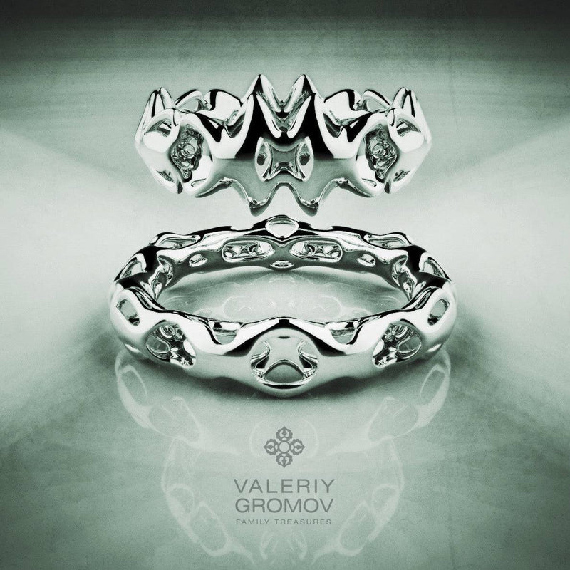 White Gold ring with intricate design on a reflective surface, featuring the Valeriy Gromov brand
