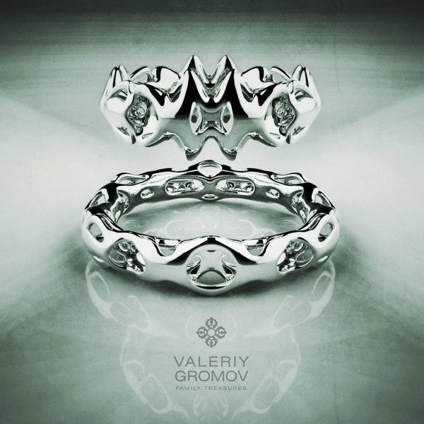 White Gold ring with intricate design on a reflective surface, featuring the Valeriy Gromov brand