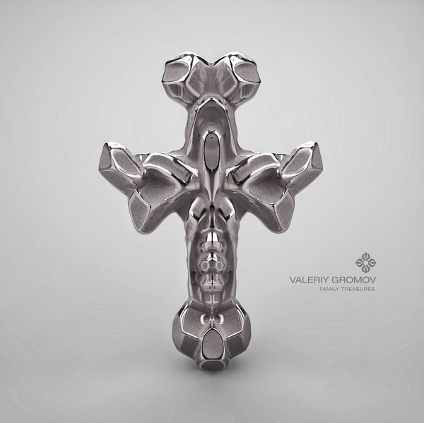 Grey gold cross pendant on a gray background with 'Valeriy Gromov Family Treasures' branding.