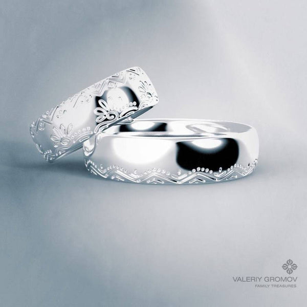 Two white gold rings with intricate designs